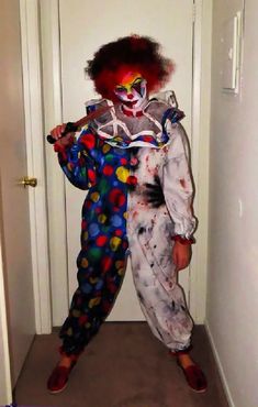 the clown is standing in front of the door