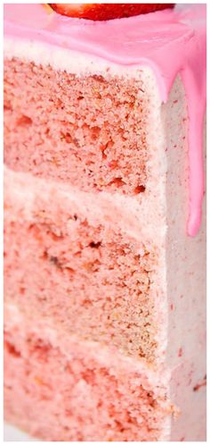 a piece of cake with pink icing on it