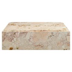 a large marble box sitting on top of a white surface