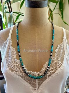 Genuine Long Turquoise Necklace with Navajo Style Pearls.  She's a pretty one ladies.  Genuine Turquoise heishi beads and Beautiful pewter colored pearls.   * 28" Long * Composite Turquoise * 28" long necklace & 5" extender * 6mm, 8mm Navajo Style Pearls (pewter colored hard enamel pearls) * 6mm turquoise * 30 grams weight (super lightweight) * Nickel, Lead & Chrome free * FREE SHIPPING What is composite turquoise Smaller pieces of turquoise may be bonded together to form larger pieces. The indi Long Turquoise Necklace, Colored Pearls, Heishi Necklace, Navajo Style, Turquoise Hoop Earrings, Natural Gemstone Necklace, Pewter Color, Turquoise Bracelet Cuff, Turquoise Cuff