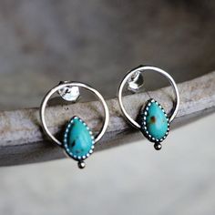 Silver hoop earrings embellished with genuine turquoise stone, perfect for adding a hint of bohemian beauty to any outfit. Size: 20 x 15 mm Post earrings Solid 925 sterling silver, genuine turquoise from Arizona By Sowell Jewelry. Stamped with 'SJ' and '925'. *Official site: sowelljewelry.com* SUBSTANTIAL PACKAGING: To ensure our packaging is as eco-friendly as possible, we only use recyclable materials such as paper and cardboard. Turquoise Hoop Gemstone Jewelry, Turquoise Gemstone Hoop Jewelry, Turquoise Gemstone Hoop Earrings, Turquoise Jewelry Stamped 925, Bohemian Small Hoop Sterling Silver Jewelry, Turquoise Hoop Pierced Earrings, Turquoise Dainty Jewelry With Earrings Set, Turquoise Sterling Silver Hoop Earrings For Pierced Ears, Hypoallergenic Turquoise Jewelry