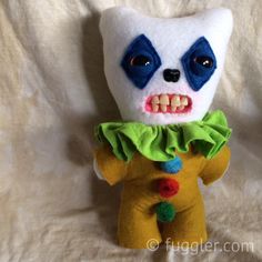 a stuffed animal with blue eyes and white teeth