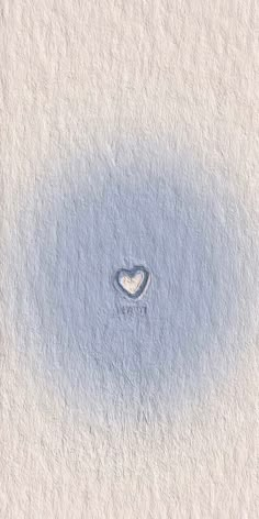 a heart shaped hole in the middle of a white wall with blue paint on it