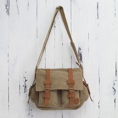 Tan and Brown Leather Accent Roomy Canvas Messenger Bag - Journey to Puno | NOVICA #handmadewithlove #readysettakeoff #supportartisans #handmade Cheap Khaki Canvas Satchel Bag, Affordable Brown Vintage Canvas Bag, Affordable Vintage Canvas Satchel, Cheap Vintage Brown Canvas Bag, Affordable Khaki Canvas Satchel Bag, Cheap Light Brown Bag With Adjustable Strap, Cheap Brown Vintage Canvas Bag, Cheap Brown Chest Bag With Pockets, Cheap Brown Satchel With Zipper Pocket