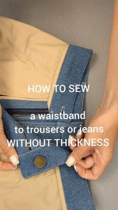 someone is holding their jeans open and showing how to sew