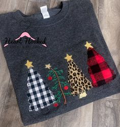 a t - shirt with three christmas trees on the front and two plaid trees on the back