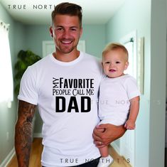 Explore our curated collection of unique Father's Day T-shirts on Etsy, celebrating the special dads in your life. Choose from a diverse range of designs that capture the essence of fatherhood. These SUPER FUN dad t-shirts are perfect for fathers day or any day! THESE SHIRTS HAVE THE OPTION OF CHANGING "DAD", "PAPA"  NAMES TO THE SHIRT                 **IN THE PERSONALIZED SECTION PLEASE ADD YOUR PREFERENCE** These t-shirts typically run true to size.  Please have a look at our sizing chart if y Father's Day Family Text Print T-shirt, Funny White T-shirt For Father's Day, Family Matching T-shirt For Father's Day, Father's Day Family Matching T-shirt With Funny Text, White T-shirt For Father's Day Gift, Father's Day T-shirt With Funny Text, Father's Day T-shirt With Name Print, Father's Day Gift T-shirt With Name Print, Father's Day Family T-shirt With Text Print