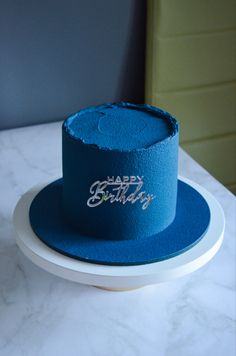 a blue hat sitting on top of a white plate