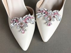 "Fun and flirty sparkly shoe clips made with the finest Swarovski crystals in light pink and clear crystal mix. Unique design with flexible appliques that adjust nicely to the curve of the shoes. Each clip measures 2 1/2\" long and 1 1/2\" wide. Available in gold, rose gold or silver finish. Shown in the silver finish in the listing. Easy to use clip-on style. The price includes one pair of clips. These are also available with all clear crystals." Luxury Silver Shoe Clips For Party, Luxury Embellished Elegant Shoe Clips, Luxury Women's Shoe Clips For Formal Occasions, Shoe Clips Ideas, White Rhinestone Shoe Clips, Glamorous Rhinestone Shoe Clips, Glamorous Embellished Shoe Clips For Prom, Glamorous Silver Shoe Clips With Rhinestones, Elegant Pink Shoe Clips For Party