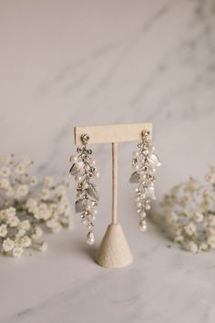 A pair of feminine statement drop earrings with pearl accents. Wedding Earrings Bride, Untamed Petals, Earrings Bride, Bride Earrings, Bridal Earrings Pearl, Statement Drop Earrings, Earrings Pearl, Wedding Earrings, Bridal Earrings