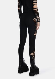 cuz rules were meant to be broken. These leggings have a stretchy construction, a cut out weaving design, lace up detailing on the sides, a low waist fit, and an elastic waistband. Edgy Black Bottoms With Holes, Edgy Bottoms With Holes For Fall, Grunge Stretch Leggings For Alternative Fashion, Gothic Tight Bottoms For Night Out, Gothic Stretch Leggings For Streetwear, Edgy Stretch Leggings, Edgy Thigh-high Leggings For Night Out, Alternative Style Stretch Pants For Night Out, Black Stretch Ripped Pants