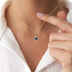 This elegant blue heart necklace is crafted with 14k solid gold, embodying timeless beauty and sophistication. Its minimalist design, combined with the finest craftsmanship, makes it a perfect piece for everyday wear or a meaningful gift for a loved one. This necklace is crafted with real 14k solid gold(not plated, not vermeil, not gold filled) You don't need to worry about water, perfume or conditioner contact since real gold doesn't tarnish. The center is a heart cut blue cubic zirconia bezel Blue Heart Necklace, Mesmerizing Beauty, About Water, August Birthstone Jewelry, July Birthstone Jewelry, Gold Colors, Heart Pendant Diamond, Jewelry Ring Box, Pearl Jewellery Earrings