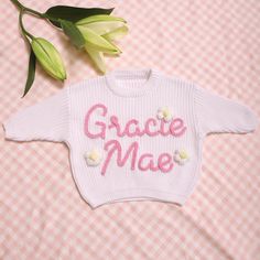 Our personalized sweaters are perfect for various occasions. These customizable sweaters are very beautiful and can be shared with baby in your life, including baby welcome parties, holiday gifts, birthdays, charming photo shoots, and capturing those precious milestone moments. They can also be used for pregnancy and childbirth announcements, as well as making a great baby shower or birthday gift! And they are also a heartfelt way to express' Congratulations! 'to add extra warmth to new or expec White Tops For Birthday And Winter, White Top For Birthday In Winter, White Long Sleeve Tops For Baptism, Cute Sweater For Birthday In Winter, Cute Crew Neck Birthday Sweater, Cute Crew Neck Sweater For Birthday, Customizable Cute Winter Sweater, Cute Customizable Winter Sweater, Cute Customizable Crew Neck Sweater