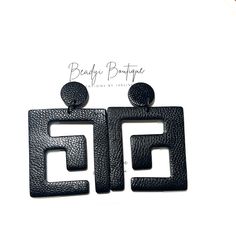 Elevate your style with these bold, and beautiful black statement earrings, handcrafted from polymer clay. The texture applied to the polymer clay was designed to give these earrings a luxurious, leather like appearance. These earrings are perfect for adding a touch of edgy sophistication to any outfit. Perfect as a gift or a treat for yourself! Despite their bold size, these earrings are lightweight, and comfortable to enough to be worn all day. They are also versatile enough to take you from d Bold Geometric Earrings With Bold Design, Bold Geometric Designed Earrings, Black Minimalist Jewelry For Everyday, Trendy Geometric Earrings For Party, Bold Geometric Earrings, Minimalist Black Single Plug Earring, Modern Black Plug Earrings As Gift, Modern Black Drop Plug Earrings, Trendy Black Earrings For Gift