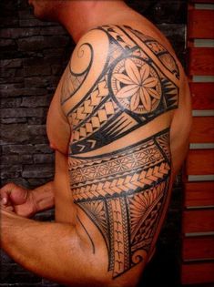 a man with a tattoo on his arm