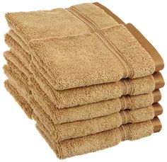 a stack of tan towels folded on top of each other