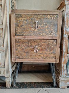 an old wooden dresser with two drawers