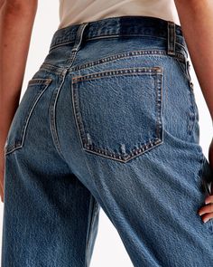 Step into the nostalgia of the early 2000s with Abercrombie & Fitch's Women's High Rise Loose Jeans. These jeans are a modern twist on a classic style, perfect for those who value both comfort and fashion.

- Size: 30 X-SHORT
- Color: Dark with Raw Hem
- Material: Body - Cotton, Lyocell; Pocket Bag - Various materials
- Gender: Female
- Fit: High rise (10.5” rise), relaxed at the waist and hips, loose full-length leg
- Features: Lightweight rigid denim, super soft authentic cotton fabric with no Distressed Dark Wash Cropped Jeans In Rigid Denim, Dark Wash Rigid Denim Jeans With Frayed Hem, Dark Wash Cotton Cropped Cutoff Jeans, Dark Wash Cotton Cutoff Cropped Jeans, Fitted Dark Wash Cutoff Jeans, Classic High Rise Rigid Denim Bottoms, Fall Cutoff Rigid Denim Jeans, Classic Denim Blue Bottoms With Frayed Hem, Dark Wash Cropped Jeans With Frayed Hem