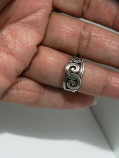 The ring is made of sterling silver with James Avery's hallmarks. The ring size is 6.5, the weight is 3.4 grams, and in excellent condition. Vintage Silver Spiral Ring, Spiral Sterling Silver Promise Ring, Elegant Spiral Sterling Silver Stackable Rings, Elegant Silver Spiral Bypass Ring, Silver Spiral Sterling Silver Ring, Sterling Silver Swirl Jewelry, Sterling Silver Swirl Jewelry In Silver, Spiral Sterling Silver Rings, Silver Spiral Ring For Anniversary