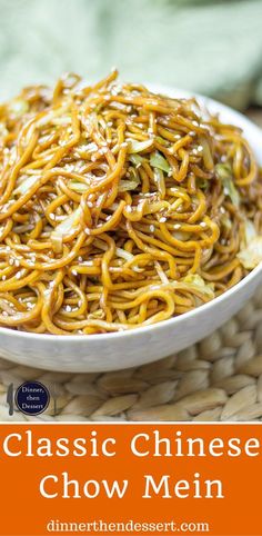 a white bowl filled with chinese chow mein on top of a wicker tablecloth