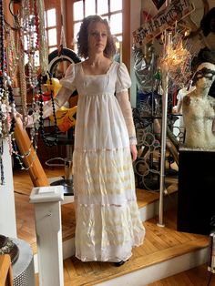 "Vintage 1970's Boho Bridal Dress, Wedding Dress, Cream and White Measurements: Arm: 20\" Bust: 35\" Waist: 28\" Length: 53\" Please don't hesitate to inquire about more specific measurements! Model in the photos is a size 3-4 and she is 5'11\" tall. She has plenty of room in this dress." White Vintage Victorian Dress For Party, Vintage Empire Waist Maxi Dress For Wedding, Vintage Empire Waist Wedding Maxi Dress, White Victorian Dress For Party, White Regency Style Victorian Floor-length Dress, Vintage Full-length Wedding Maxi Dress, Vintage Full-length Maxi Dress For Wedding, Vintage Maxi Prairie Dress For Wedding, Fitted Floor-length White Vintage Dress