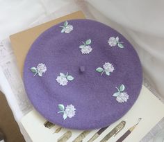 Introducing our delicate and charming Light Lilac Wool Beret with Purple Embroidered Lavender. Handcrafted with care, this beret is made from soft, premium quality wool, ensuring comfort and warmth all day long. The beautiful lilac shade adds a touch of femininity, while the intricate purple embroidered lavender design adds a hint of whimsical elegance. Perfect for adding a stylish and unique flair to any outfit, this beret is a must-have accessory for fashion enthusiasts. Whether you're strolli Wool Berets, Unique Fall, Fall Accessories, Lilac, Lavender, Accessories Hats, Violet, Etsy Accessories, Wool