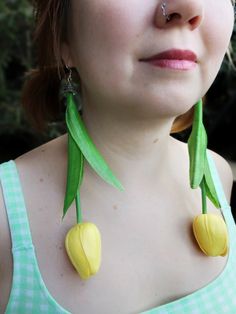 Make a bold statement with our large yellow tulip earrings, crafted from lightweight EVA foam material! These handmade earrings are designed to turn heads with their giant floral design, perfect for those who love to stand out. Despite their size, they are incredibly comfortable to wear, adding a touch of whimsy and elegance to any outfit. Embrace the beauty of oversized accessories and let your style bloom with these stunning tulip earrings! ►  Free shipping on orders $35 or more for US buyers  ► The fake tulips are made of EVA material. ► Please note that since all of these exclusive jewelries are handmade, there may be some differences from the pictures. Please feel free to message me with any questions you may have. Thank you for visiting my store. Drop Length : 20 cm (8") Oversized Accessories, Fake Tulips, Earrings Artificial, Tulip Earrings, Yellow Tulips, Exclusive Jewelry, Flower Jewelry, Eva Foam, Light Weight Earrings