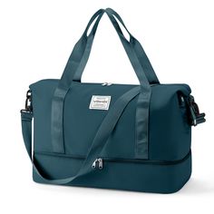 a teal colored handbag is shown with the strap down to it's shoulder