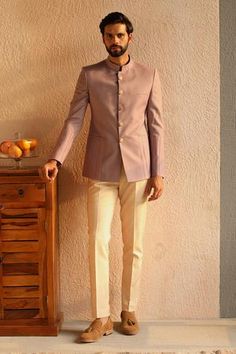 Lavender perennial wool blazer style bandhgala  with pintuck detail.
Component: 1
Neckline: Mandarin collar
Sleeve Type: Full sleeves
Fabric: 100% Perennial wool 
Color: Purple
Other Details: 
Flat buttons
Welt pockets
Note: Pant worn by the model is not for sale
Occasion: Wedding - Aza Fashions Mens Outfit For Sisters Wedding, Rajputi Jodhpuri Suits For Men, Bandhgala Suit Men Engagement, Lavender Jodhpuri Suits For Men, Men Bandhgala Suits, Rajputi Dress For Men, Bandhgala Suit Men Wedding, Blazer Outfits Men Wedding Indian, Bandgala For Men