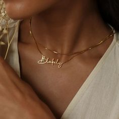 "B O X ∙ C H A I N ∙ N A M E ∙ N E C K L A C E * Material: High Quality Solid 925 Sterling Silver * Dimensions: Depending on your font choice, height sizes range from 3mm to 4mm lowercase. * Finish: Sterling Silver ∙ 18K Gold ∙ Rose Gold * All our jewelry is custom made by hand with Love and Care in our workshop ♡ H O W ∙ T O ∙ O R D E R * Simply use the 'PERSONALIZATION BOX' to let us know the NAME and the FONT NUMBER that you would like. NAME + FONT NUMBER ♡ * If a font is not given, you will receive the font that is pictured. O T H E R ∙ I N F O R M A T I O N * The length option is the TOTAL chain length (including the name). If you order a 14\" chain, the piece will come as CHAIN + NAME = 14\". All pieces will come with a 1\" extension chain so you can FINE TUNE the fit. * All items ar Necklace Chain Types, Gold Name Necklace, Nameplate Necklace, Silver Chain Style, Name Jewelry, Custom Name Necklace, Perfect Gift For Her, Custom Necklace, Stainless Steel Necklace