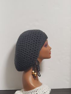 Step up your style game with this handmade charcoal crochet dreadlock tam with drawstring slouchy hat. This unisex beanie is perfect for casual occasions and comes in size L. The acrylic material and crochet fabric type provide a stretchy and comfortable fit, making it perfect for winter, fall, and spring seasons. The hat is handmade with love in the United States and features a solid pattern, reggae character, and hippie/boho theme. It also comes with a drawstring for a customizable fit. This hat is perfect for Christmas and outdoor activities and is sure to make a statement Casual Gray Crochet Hat One Size, Adjustable Gray Crochet Beanie Hat, Handmade Adjustable Gray Crochet Hat, Adjustable Handmade Gray Crochet Hat, Casual Gray Crochet Hat, Handmade Gray Crochet Hat Casual Style, Handmade Casual Gray Crochet Hat, Casual Handmade Gray Crochet Hat, Hippie Love