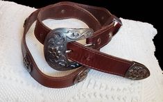 Women's western waist belt Color brown  Engraved buckle  1995 Length 38 inches  First hole at 28, 29,30, 31,32 inches  See measurements on photo please  Great vintage condition Western Concho Belts For Ranch, Southwestern Concho Belt For Rodeo, Western Antique Belt Buckles For Festival, Western Antique Belt Buckle For Rodeo, Southwestern Antique Belt Buckle For Rodeo, Southwestern Antique Belt Buckles For Ranch, Western Belts And Suspenders For Ranch, Western Style Brown Antique Belt Buckle, Western Brown Belts And Suspenders With Antique Buckle