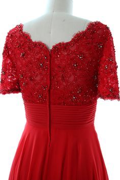 a red dress with sequins on the shoulders