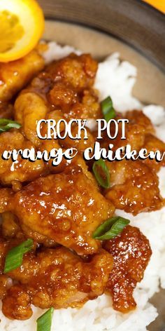 crock pot orange chicken on top of rice with lemon wedges and garnish