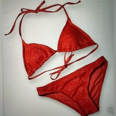 Elevate Your Beach Look With This Stunning Vincento Camuto Bikini In A Beautiful Red Hue. The Two-Piece Swimsuit Features A Triangle Top With Spaghetti Straps And A Hipster Bottom Style. The Bikini Is Made Of Spandex And 100% Polyester Material, Making It Comfortable And Machine Washable. The Garment Care Is Easy, And The Bikini Is Perfect For A Day At The Beach Or Pool. The Bohemian Theme Is Accentuated By The Crochet Detailing, Making It A Stylish Addition To Your Swimwear Collection. This Bik Lined Red Swimwear For Beach Season, Red Lined Swimwear For Beach Season, Red Fitted Swimwear For Holiday, Fitted Red Swimwear For Holiday, Red Fitted Holiday Swimwear, Bohemian Theme, Crochet Triangle, The Bohemian, Triangle Top