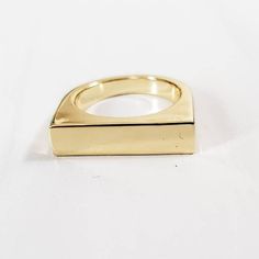 This ring is everything! The 90s are back and so is this gold plated brass flat top ring.  It's a trendy and fun 18k gold plated brass ring blank perfect for jewelry making either by engraving or stamping.  About the item: * The ring blank is shiny and heavy. * The flat top measures 5mm x 20mm and can fit a decent amount of text. Gold Rectangular Metal Rings, Modern Gold Brass Signet Ring, Gold Brass Signet Ring For Everyday, Everyday Gold Brass Midi Rings, Everyday Gold Stackable Brass Rings, Minimalist Gold Signet Ring In Brass, Minimalist Gold Brass Signet Ring, Gold Stackable Rings For Everyday Wear, Gold Stackable Metal Rings For Everyday