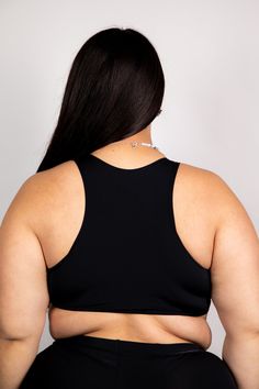 Introducing our Matte Black Teaser Top - the ultimate must-have for all you EDM lovers out there! 🎶 This plain black design is anything but basic - it's a print that's bound to captivate your imagination and make you the star of the show! ✨ Our Teaser Crop Top is not only supportive, but it's also irresistibly sexy. With its unique style, it's guaranteed to make you stand out from the crowd and leave everyone in awe. 💃 But that's not all, this fabulous top is made on recycled material, because Black Stretch Crop Top With Built-in Bra, Black Full Coverage Sports Bra With Built-in Bra, Stretch Black Crop Top With Built-in Bra, Black High Stretch Seamless Crop Top, High Stretch Seamless Black Crop Top, Black Stretch Bra-friendly Crop Top, Black Activewear With Medium Bust Support And High Stretch, Black Sports Crop Top With Medium Bust Support, Black Seamless Gym Crop Top