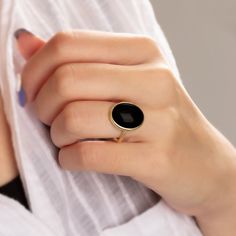 "\"Vintage Black Onyx Ring - Exquisite Black Onyx Ring\" Elevate your style with this extraordinary Black Onyx ring, designed to captivate and leave a lasting impression. Crafted with precision, this statement piece showcases a genuine Black Onyx gemstone, renowned for its deep, mysterious allure. Key Features: - Genuine Black Onyx: This ring features a stunning, high-quality Black Onyx stone that exudes elegance and sophistication. - Unique Design: Our expert artisans have meticulously crafted Formal Black Oval Enamel Ring, Black Oval Enamel Ring, Elegant Black Oval Dome Ring, Black Vintage Enamel Ring, Black Oval Enamel Ring For Formal Occasions, Modern Black Dome Ring, Classic Black Cabochon Rings, Minimalist Black Enamel Rings, Minimalist Ring With Black Enamel