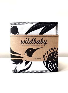 a wallet with a bird on it and the words wildbaby printed on it