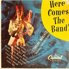 there comes the band poster with an image of a man in costume