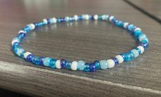 Dainty Beaded Ankle Bracelet, Small Blue and white Glass Beads, Beach Anklet, Ocean Lover Gift, Summer Jewelry, Vacation Accessories  Made with durable clear stretchy cord Your choice of size! Ankle bracelet are : Small is 10 inches  Medium is 10.5 inches (this size fits most) Large is 11 inches  Bracelets are 7.5 inches  If you need a specific length, please include a buyers note with your order so I can accommodate that request! Blue And White Beads Bracelet, Ankle Bead Bracelets, Ocean Bracelet Ideas, Ankle Bracelets Beads, Blue Bracelet Ideas, Vacation Bracelets, Blue Beads Bracelet, Blue And White Bracelet, Blue Bracelets