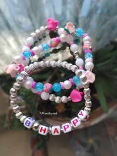 "It is a motivational stack bracelet for girls with the word \"B.Happy\". The colourful set of 3 bracelets is a mood uplifting, making it a perfect accessory for summertime outfit." Motivational Bracelets, Bracelet For Girls, Summertime Outfits, Stack Bracelet, Rave Accessories, Kids Bracelets, Summer Bracelets, Bracelet Ideas, Bracelet Stack