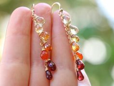 THE JEWELRY IS SHIPPED via DHL EXPRESS (2-5 days delivery door to door). THE DHL SHIPPING COST IS INCLUDED IN THE PRICE. The Sunset Earrings - Solid Gold 14K Multi Gemstone Orange Red Drop Colorful Earrings► Measurements / Details:- Length of the earrings including earwires: 2.17" (~5.5 cm)- Gold: All the components are 14K SOLID GOLD (stamped on the earwires)► Gemstones:The Earrings include excellent AAA quality gemstones, superbly faceted and vibrant:~ Lemon Quartz drops~ Citrine drops~ Padpar Fine Jewelry Multi-stone Drop Earrings, Gold Multi-stone Drop Gemstones, 14k Gold Briolette Earrings, Dangle Multi-stone Earrings For Gifts, Teardrop Multi-stone Earrings As A Gift, Multi-stone Long Drop Jewelry Gift, Long Drop Multi-stone Earrings For Gift, Fine Jewelry Teardrop Multi-stone Earrings, Multi-stone Drop Earrings For Gift