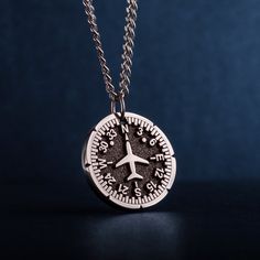 "Airplane Heading Indicator Necklace. Introducing our personalized round unisex pendant - a unique and thoughtful gift for Cabin crew, Flight attendants, adventure and travel lovers. The pendant features a captivating image of a Heading Indicator and aircraft. The Heading Indicator represents direction and guidance, reminding the wearer to follow their path and stay true to themselves. Crafted with high-quality jewelry stainless steel, this pendant is not only stylish, but also durable - suitable for pilot, aviation enthusiasts, commuters, adventures, backpackers, and anyone who loves the great travel. The personalized round pendant is a men's necklace that makes a perfect gift for dad, husband, or guy, whether for Father's Day, his birthday, or any other special occasion. A pendant with n Engraved Pendant Necklace Souvenir, Personalized Silver Necklace For Souvenir, Personalized Adjustable Jewelry For Travel, Engraved Round Pendant Jewelry For Souvenir, Engraved Round Pendant Jewelry As Souvenir, Personalized Round Necklace With Polished Finish, Souvenir Round Pendant Necklace With Charms, Round Medallion Necklace With Charms As Gift, Round Medallion Necklace With Charms For Gifts