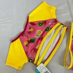 My Baby Girl Has Grown Out Of This Swimsuit Before She Was Able To Wear It. I Bought Multiple Swimsuits With This Design And They Were Great For Her! Happy Shopping! Summer Stretch Bodysuit For Playwear, Playful Stretch Summer Bodysuit, Playful Yellow Swimwear For Swimming, Stretch Swimwear For Summer Playtime, Cute Yellow Fitted Swimwear, Cute Fitted Yellow Swimwear, Cute Yellow Bodysuit For Playwear, Yellow Beachwear Bodysuit For Swimming, Yellow Summer Bodysuit For Pool