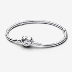 Complete Your Sophisticated Look With This Elegant Pandora Bracelet. Made With A Sleek Silver Snake Chain And Featuring A Heart-Shaped Clasp, It Exudes Professionalism And Fine Craftsmanship. The Versatile Design Allows You To Add Your Own Personal Touches With A Variety Of Charms. Show Your Love And Appreciation With This Stunning Bracelet. - Pandora - Moments - Heart Clasp - Snake Chain - Bracelet Available Size 17,18,19,20 Pandora Chain Bracelet, Pandora Heart, Charms Pandora, Bracelet Pandora, Pandora Hearts, Snake Chain Bracelets, Pandora Bracelet Charms, Pandora Silver, Silver Snake Chain