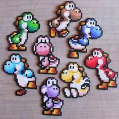 the pixelated video game characters are displayed on a table