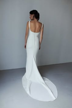 the back of a woman in a white dress