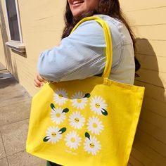 Brighten your day with this happy yellow tote bag featuring a screenprinted illustration by Vica Lew! This cotton tote is roomy and comes with a bottom gusset that makes it perfect for carrying all your essentials for your daily adventures. ♥   ★★  ITEM DESCRIPTION  ★★ - Illustration is screen printed on a 100% cotton tote bag - Approx. 20in x 15in x 5in - Bottom gusset - Approx. 10in handle drop ★★  CARE INSTRUCTIONS  ★★ - Spot clean with a damp cloth and allow to air dry - Using a washing mach Spring Yellow Canvas Bag For Daily Use, Everyday Yellow Canvas Bag, Spring Yellow Canvas Bags, Large Capacity Yellow Cotton Canvas Bag, Eco-friendly Yellow Bags For Spring, Spring Yellow Canvas Bag For Everyday Use, Yellow Cotton Canvas Shopping Bag, Spring Yellow Canvas Bag For Everyday, Fun Yellow Bags For Everyday Use