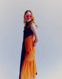 A unique dress sewn from a combination of fabric and knit in two strong colors: orange and pink. The dress is made of two parts, the first loose, sewn from checked fabric with a classic collar, the second fitted to the silhouette. The two parts complement each other perfectly. There is a pocket on the right side. The dress is fastened with buttons. In the front above the bust and at the back a delicate cutout. This is a very unique and interesting cut of the dress, which will also work well in t Fitted Orange Maxi Dress With Ruffles, Fitted Orange Maxi Dress For Dress Down Occasions, Orange Midi Dress For Dress Down Occasion, Orange Fitted Midi Dress For Casual Wear, Orange Sleeveless Patchwork Dress, Fitted Orange Patchwork Dress, Orange Ruffled Evening Dress, Orange Midi Length Dress Down Dress, Orange Ruffled Maxi Dress For Evening